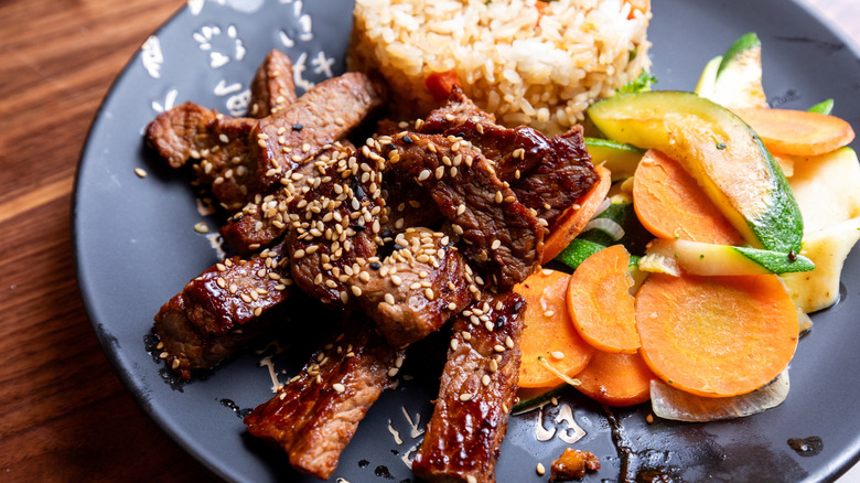 hibachi steak on plate with rice and vegetables