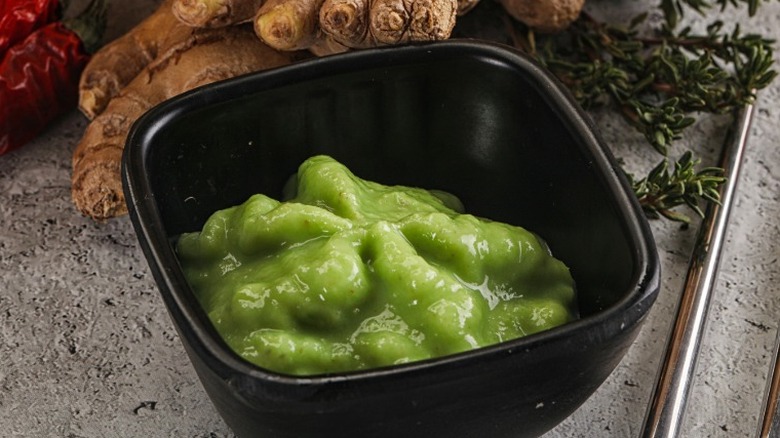 A dish of wasabi on a countertop