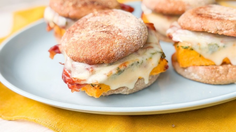 Close up of high-protein English muffin breakfast sandwiches on platter