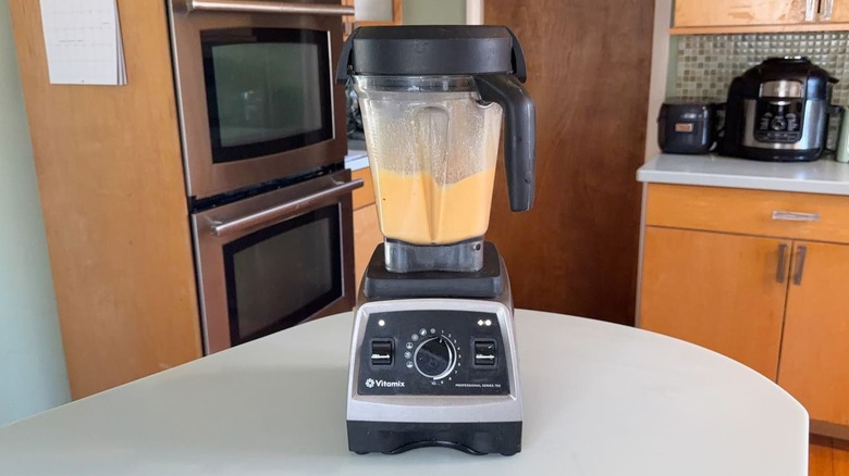 Blending eggs and seasonings in high-speed blender