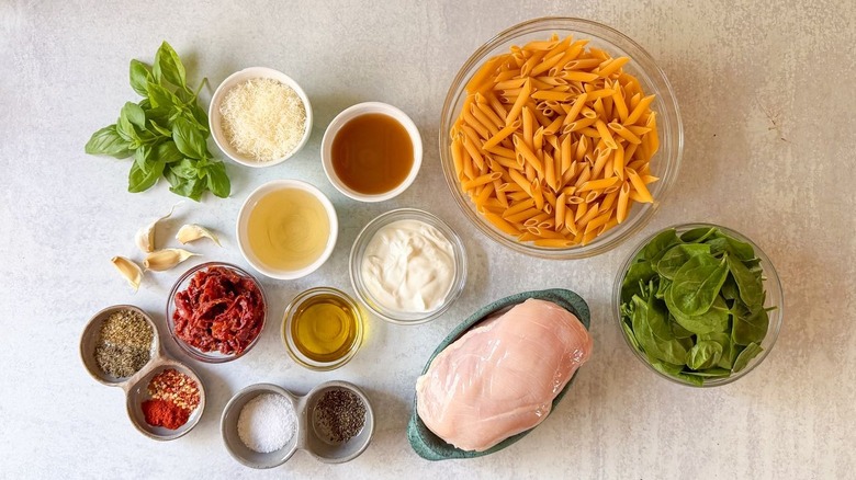 High protein marry me chicken pasta ingredients on countertop