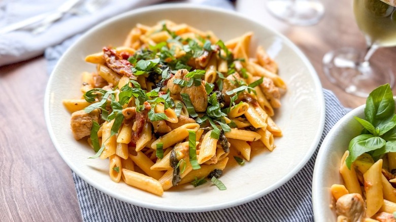 High protein marry me chicken pasta in serving dish