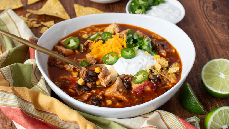 chicken and bean soup in a white bowl