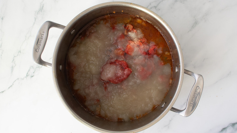 vegetables and broth in a metal pot