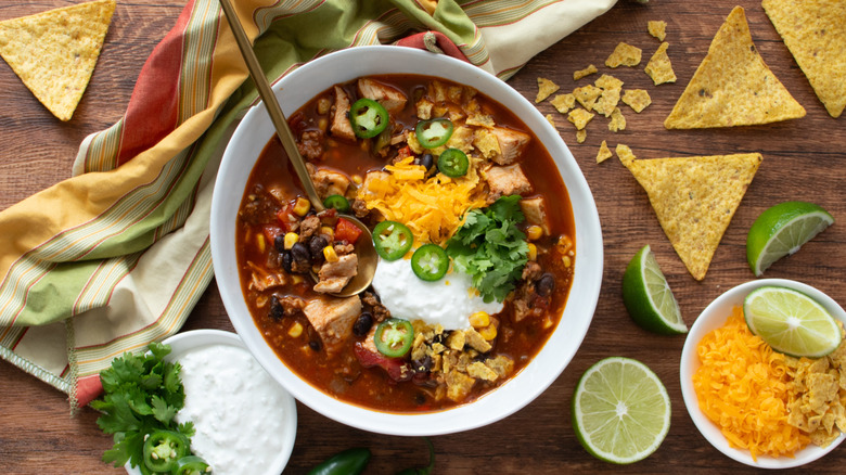 chicken and bean soup in a white bowl
