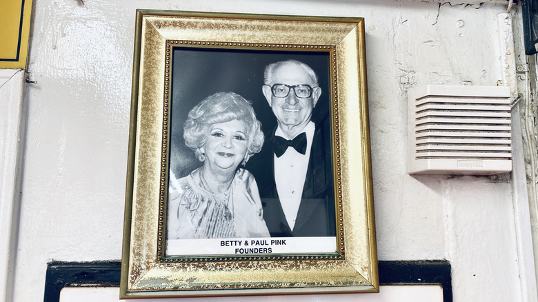 Framed photo of founders Betty and Paul Pink on the wall at Pink's Hot Dogs