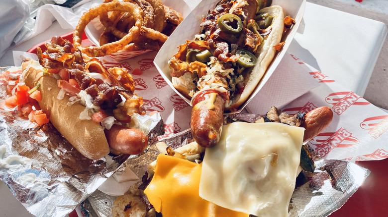 Assortment of hot dogs and onion rings at Pink's Hot Dogs