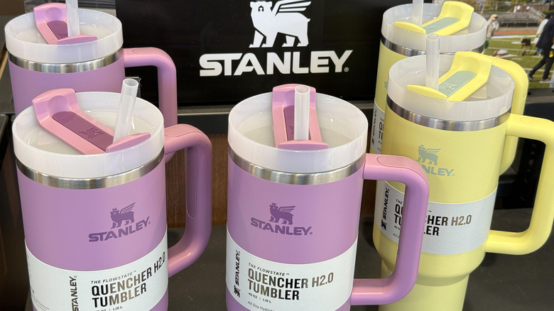 Stanley tumbler display with purple and yellow Quencher cups