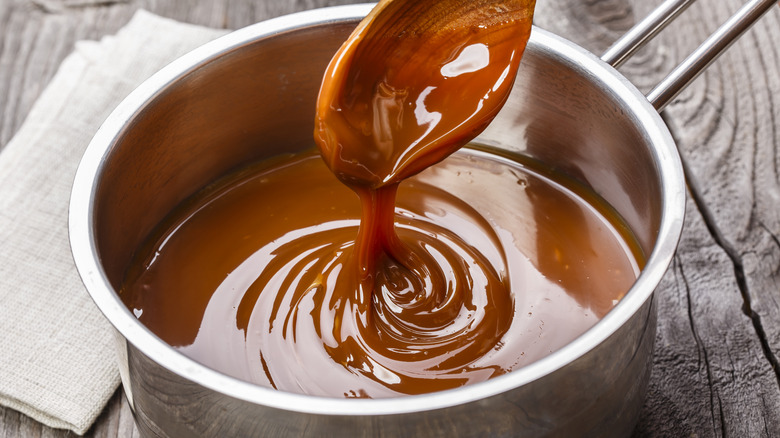 liquid caramel sauce in a ceramic bowl