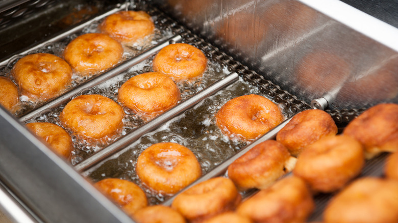 Doughnuts fry in a fryer