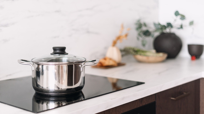 A pot left alone in an empty kitchen