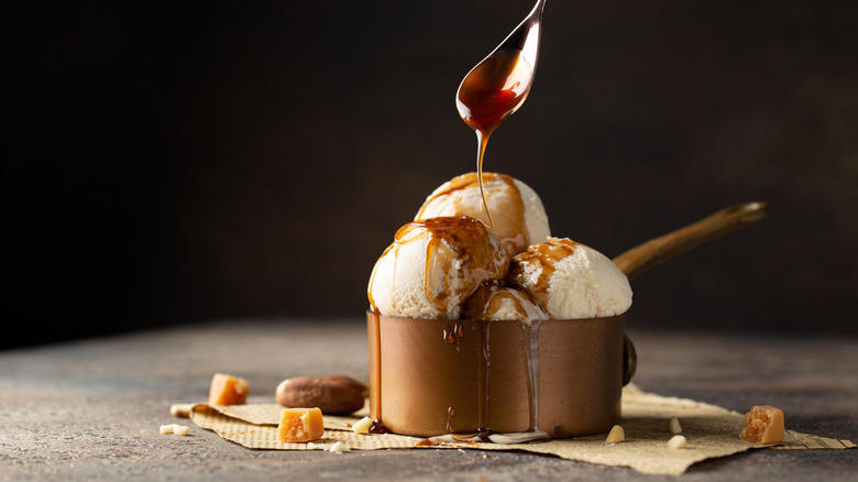 Homemade ice cream topped with caramel sauce