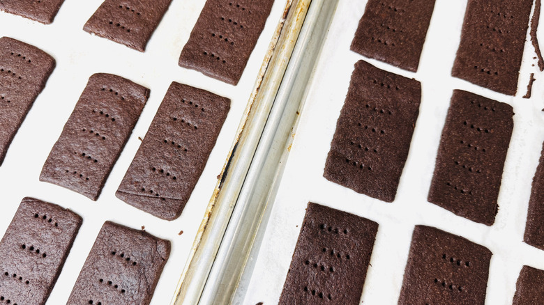 Chocolate cookie rectangles baked on sheet trays