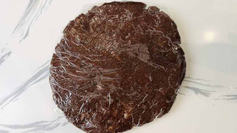 Disk of chocolate cookie dough ready to chill