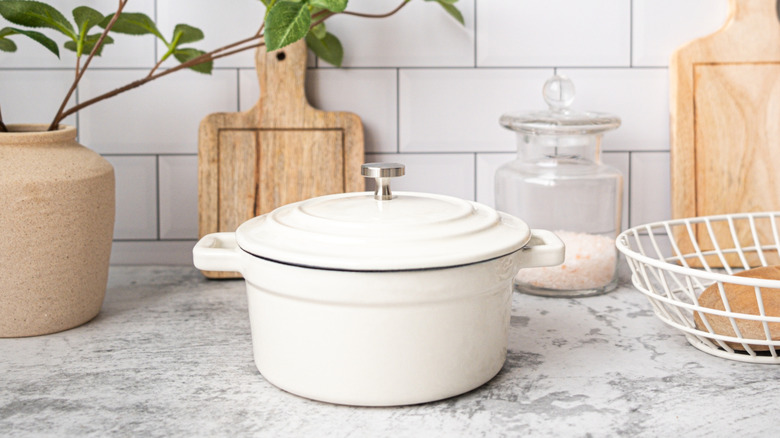white cast iron pot on counter top