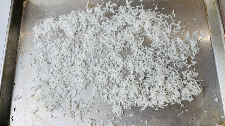 Shredded coconut on baking sheet
