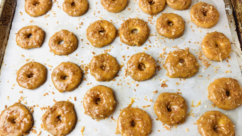 Coconut sprinkled over dipped homemade Samoas