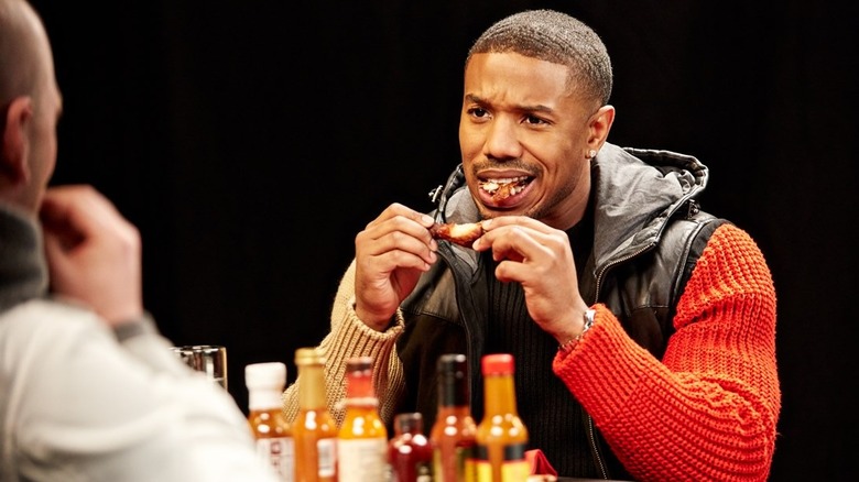 Michael B. Jordan eats a wing on Hot Ones
