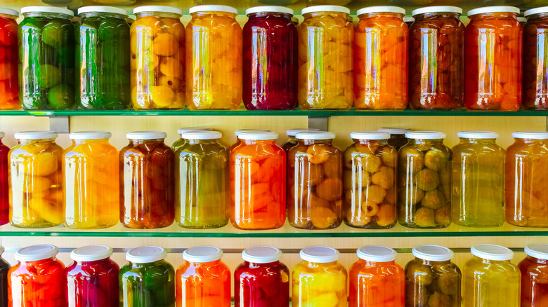 Jars of canned vegetables on a shelf