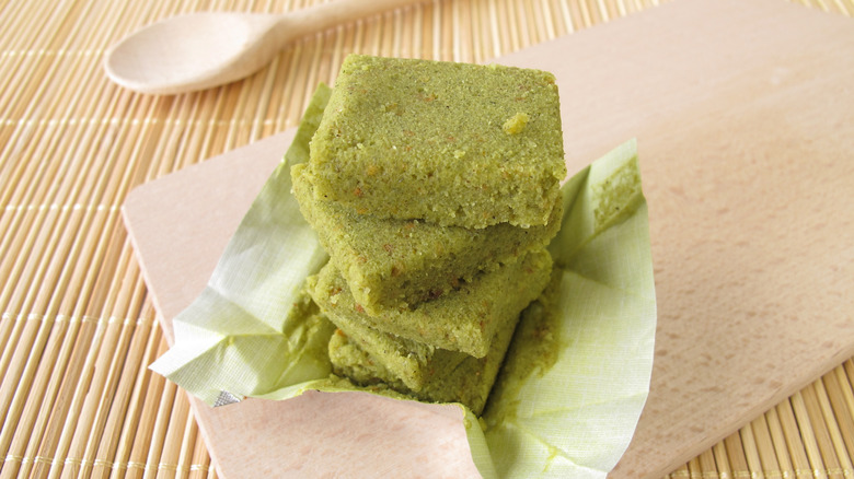Vegetable bouillon cubes are stacked on a board
