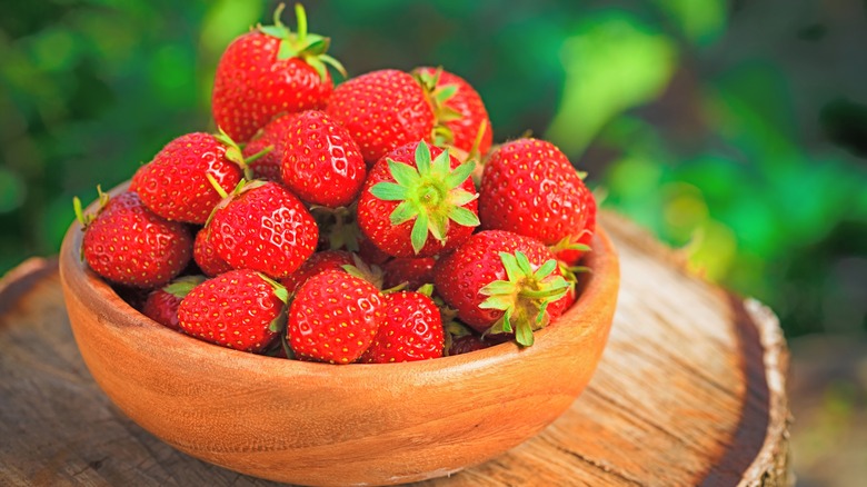 wooden bowl of strawberries