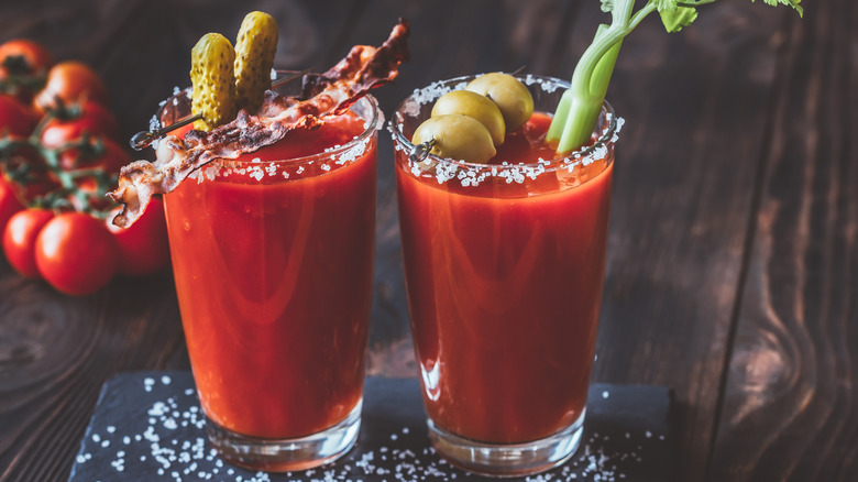 Two garnished Bloody Mary glasses