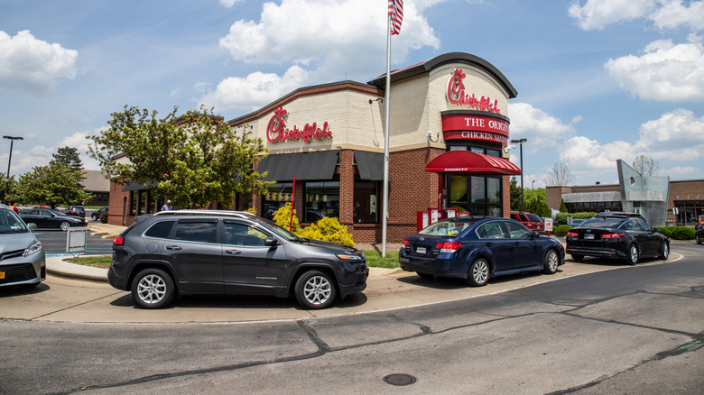 Customers in line at a Chick-fil-A drive-thru