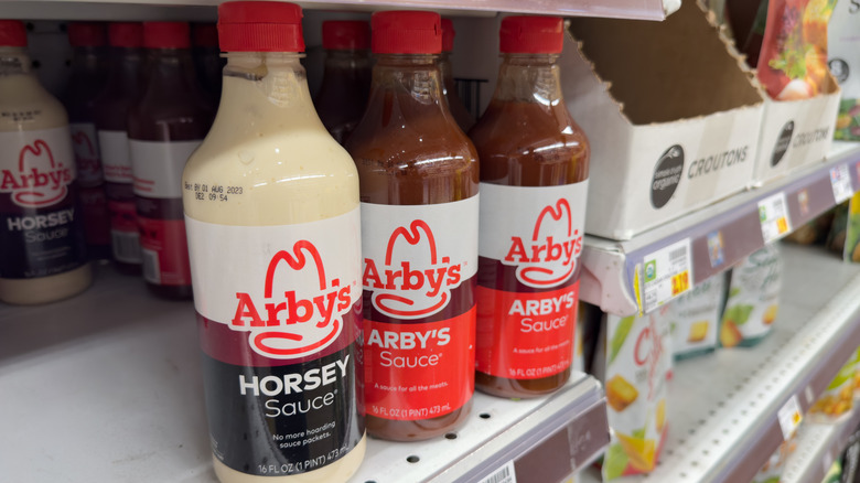 Bottles of Arby's sauce and Horsey Sauce on a store shelf