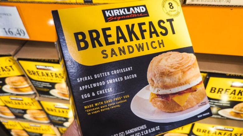 A Kirkland Signature frozen breakfast sandwich in a box in the freezer section
