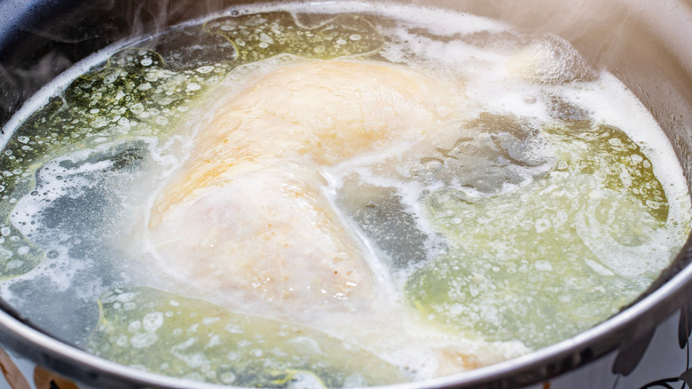 close-up of a boiled chicken in a pot