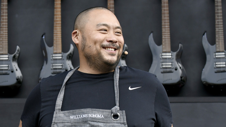 David Chang wearing an apron