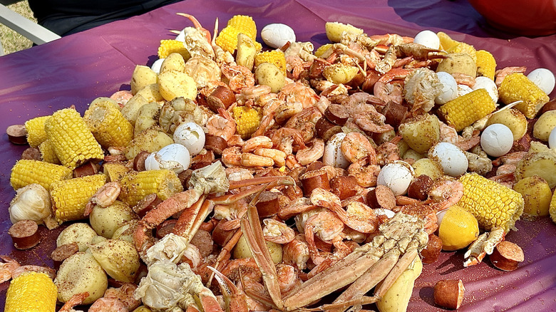 Low country seafood boil with eggs, corn, and sausage as additions to the seafood