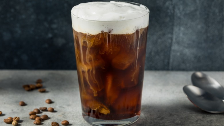 Cold brew coffee in a glass with cold foam