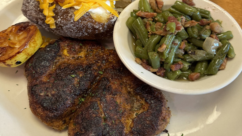 Green beans, chicken breast, and baked potato