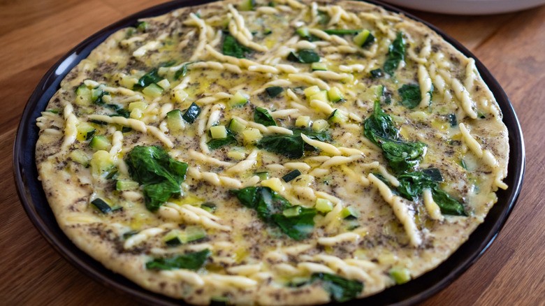 an omelette or frittata with trofie pasta and spinach