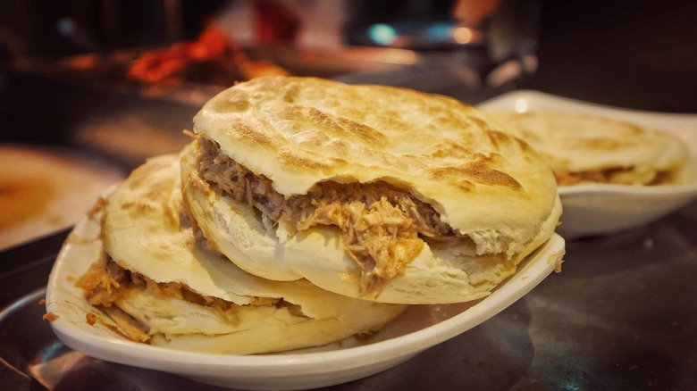 Rou jia mo stuffed with a pork filling on a plate