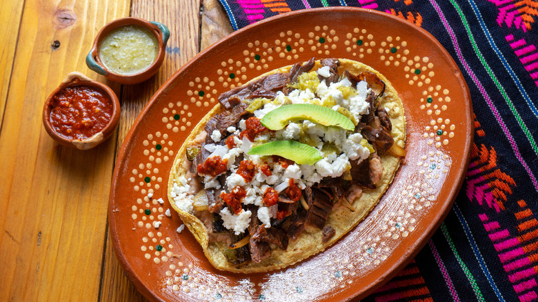 Huarache served on a traditional plate