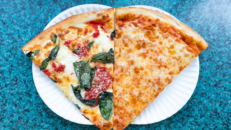 pizza slices on paper plates side-by-side