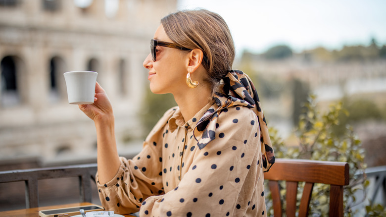 Person enjoying a cup of coffee