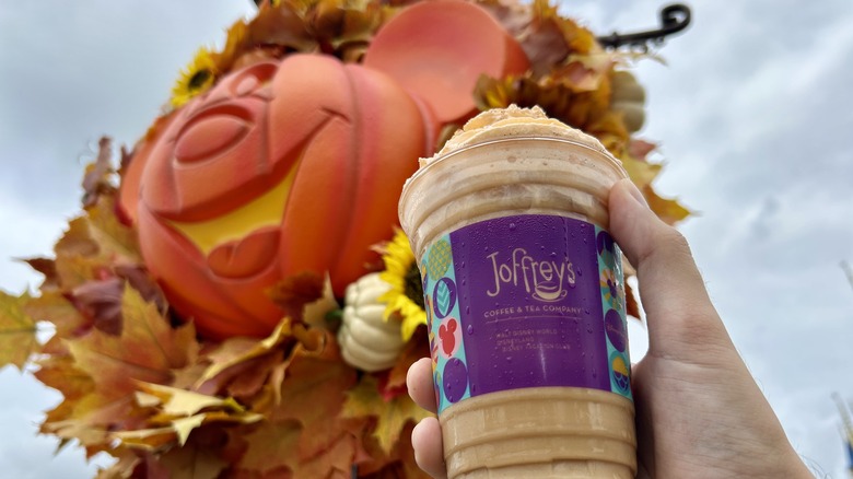 a cold Joffrey's beverage in front of a pumpkin mickey