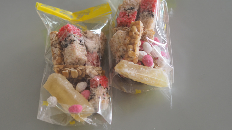 An illustrative image showing sweets concealed in a plastic bag.