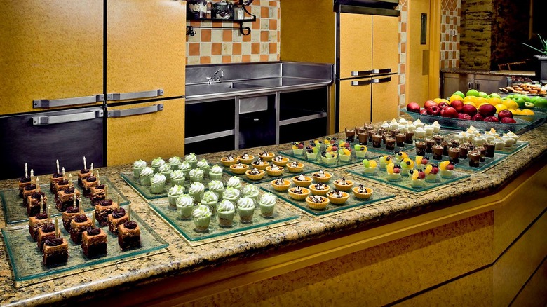 Dessert offerings, including fruit, tarts, and key lime pie shooters