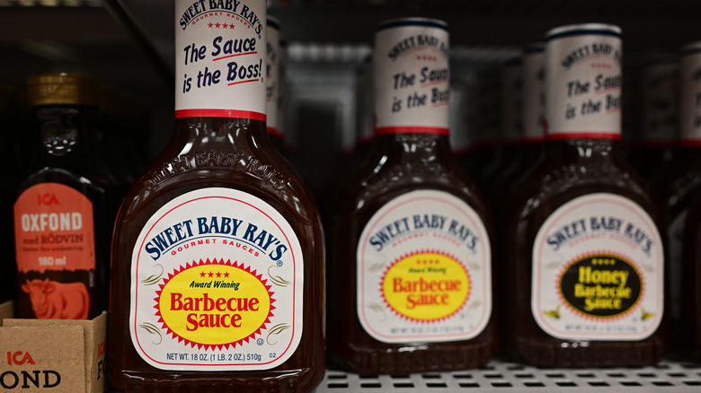 Bottles of Sweet Baby Ray's barbecue sauce on shelf