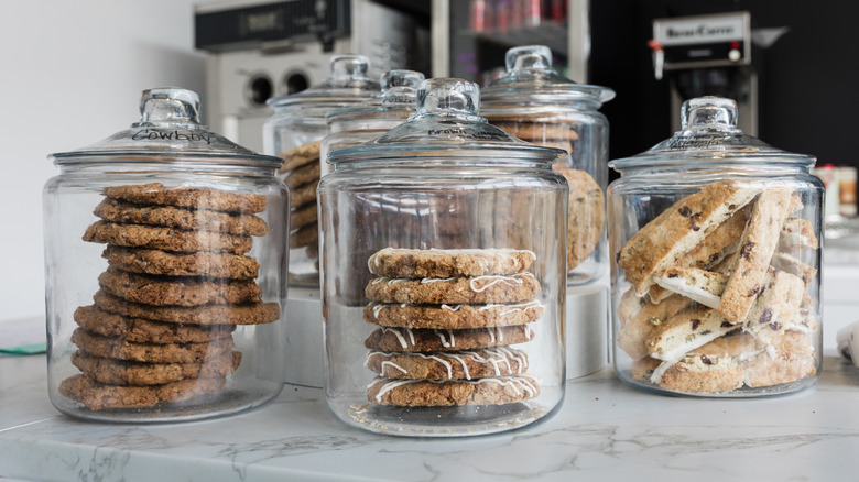 Jars of store-bought cookies on a kitchen counter