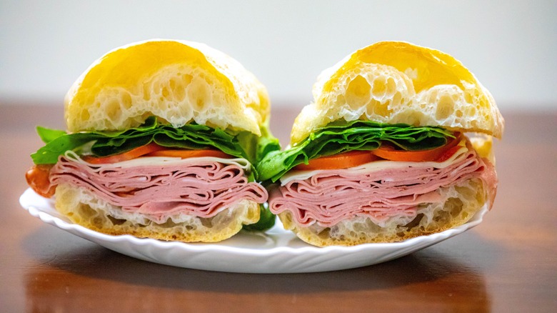 Bologna sandwich on white plate