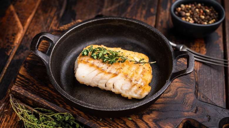 Cooked fish in skillet