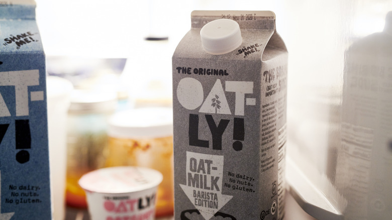 carton of oat milk in fridge