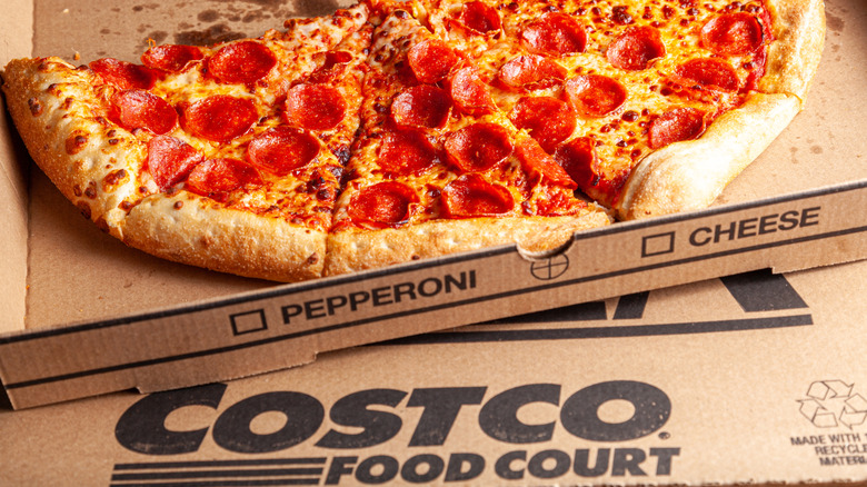 an open box of half eaten Costco pepperoni pizza