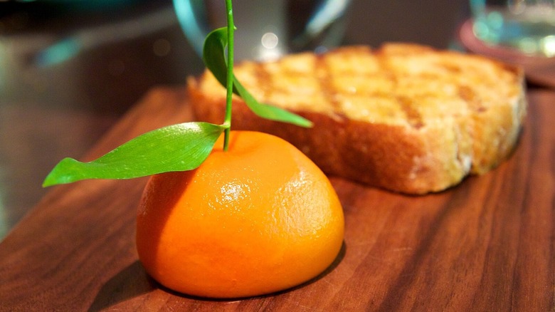 Heston Blumenthal's Meat Fruit on a wooden cutting board
