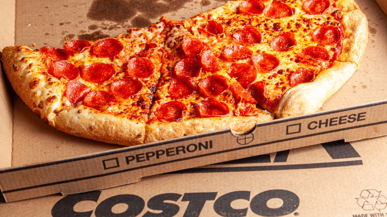 A pizza over a Costco food court box